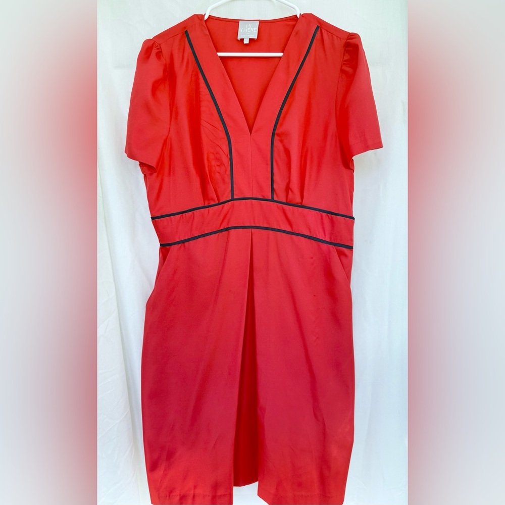 Hi There by Karen Walker, feminine cut and classic style. Red V neck w pockets